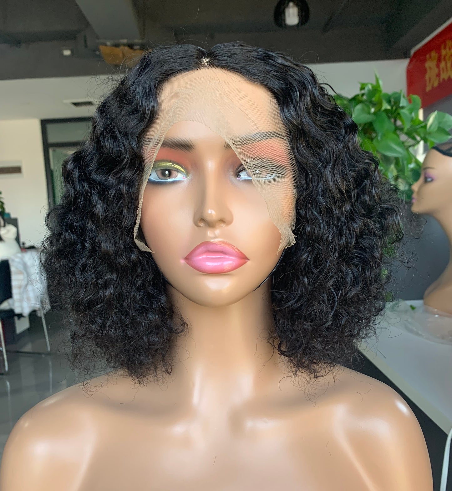 Mayqueen curly 13x4 high definition transparent T-shape Swiss lace wig for black women.